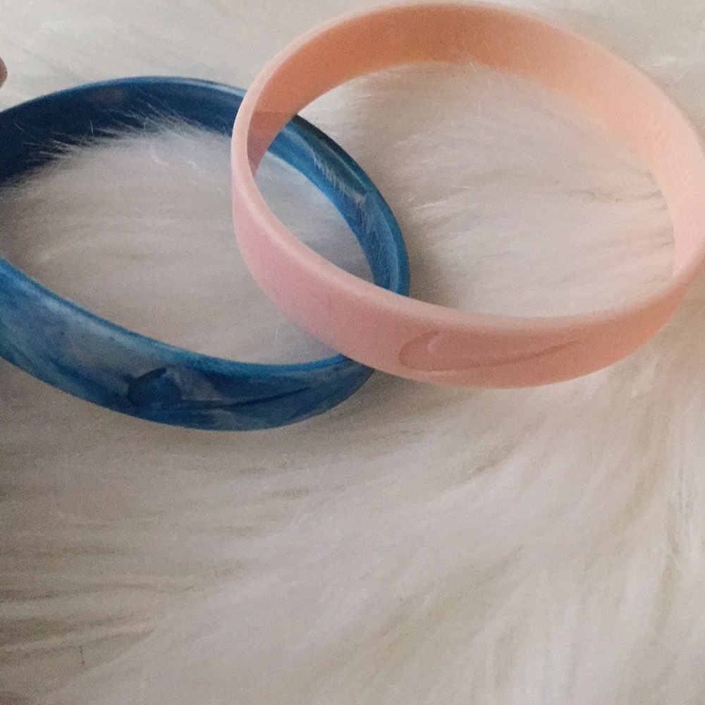 Two Nike rubber bracelets